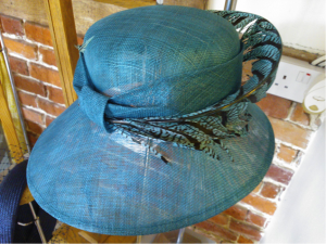 This beautiful teal sinamay hat with Lady Amhusrt pheasant feather  Was £295 Now £95.
