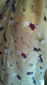 To all the dog lovers, enjoy this pastel coloured scarf coated in prints of dogs..